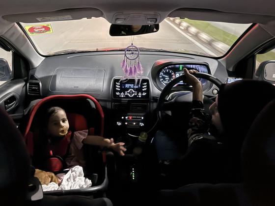 Interior of a car, child in the back seat