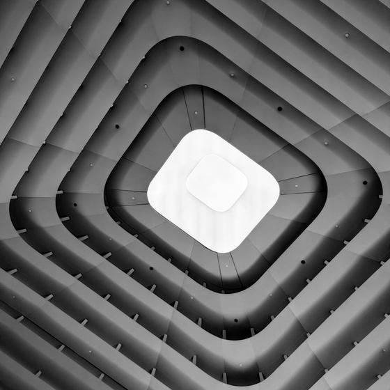 Concentric square ceiling in monochrome